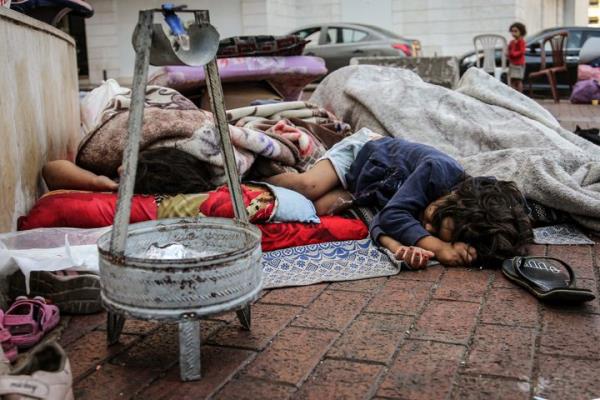 Lebanese children, who fled a southern suburb of Beirut with their families, sleep on pavement in Beirut after they failed to find a public school or a shelter to go to. Thousands of Lebanese and Syrians natio<em></em>nals have fled south Lebanon, the suburbs and Lebanon's Bekaa valley east of the country because of the daily Israeli air raids.