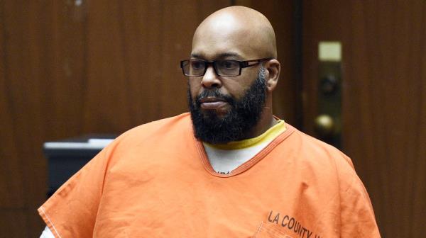 Suge Knight beard glasses orange jumpsuit in court